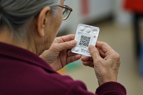 Elderly patient scanning medicine QR code using augmented reality– Immexive