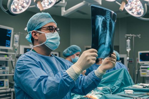 Doctor examining X-ray image during surgery using augmented reality in hospitals – Immexive